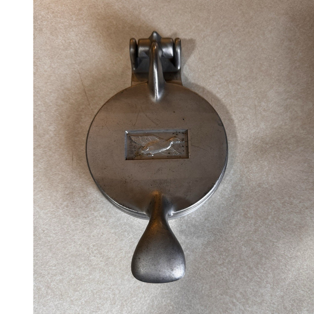 vintage aluminum meat press with duck