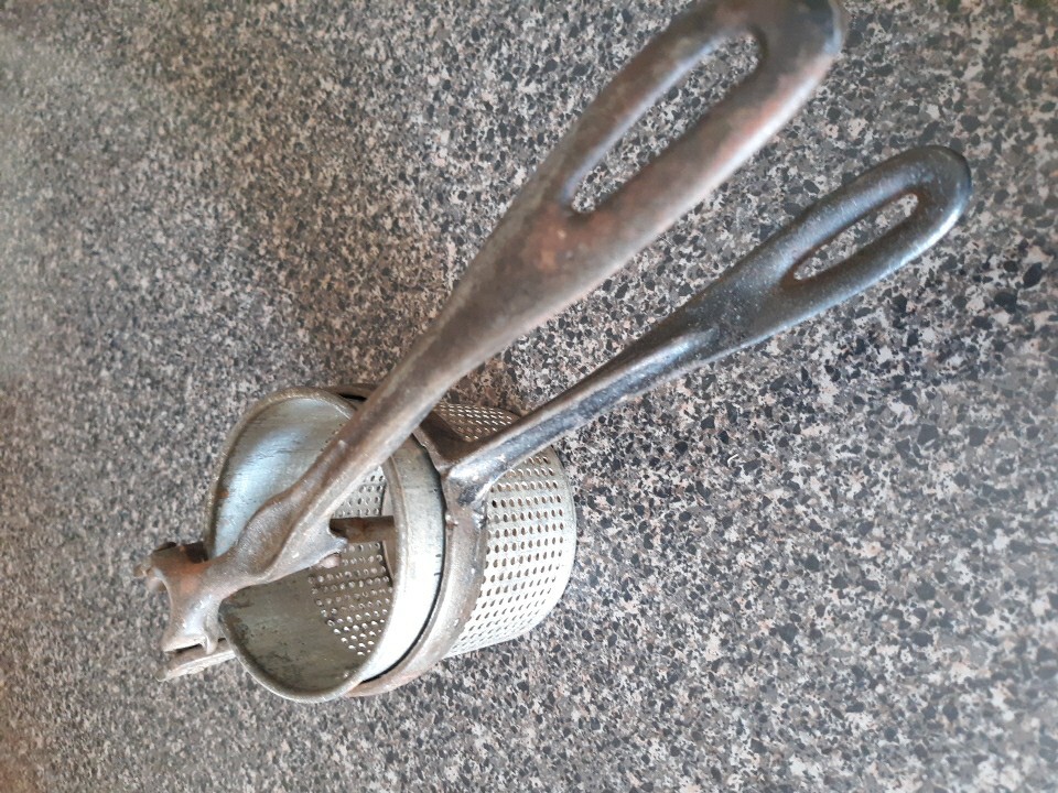 Collectible Vintage Metal Food Press gallery
