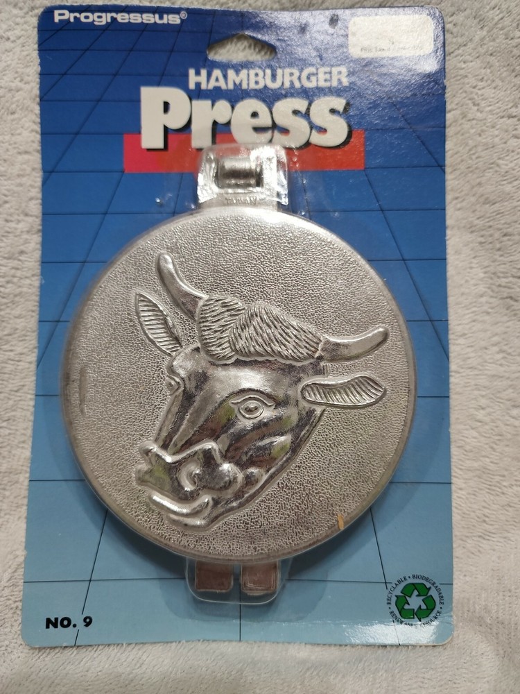 Hamburger Press. Made by progresses. Embossed cow on the top.
